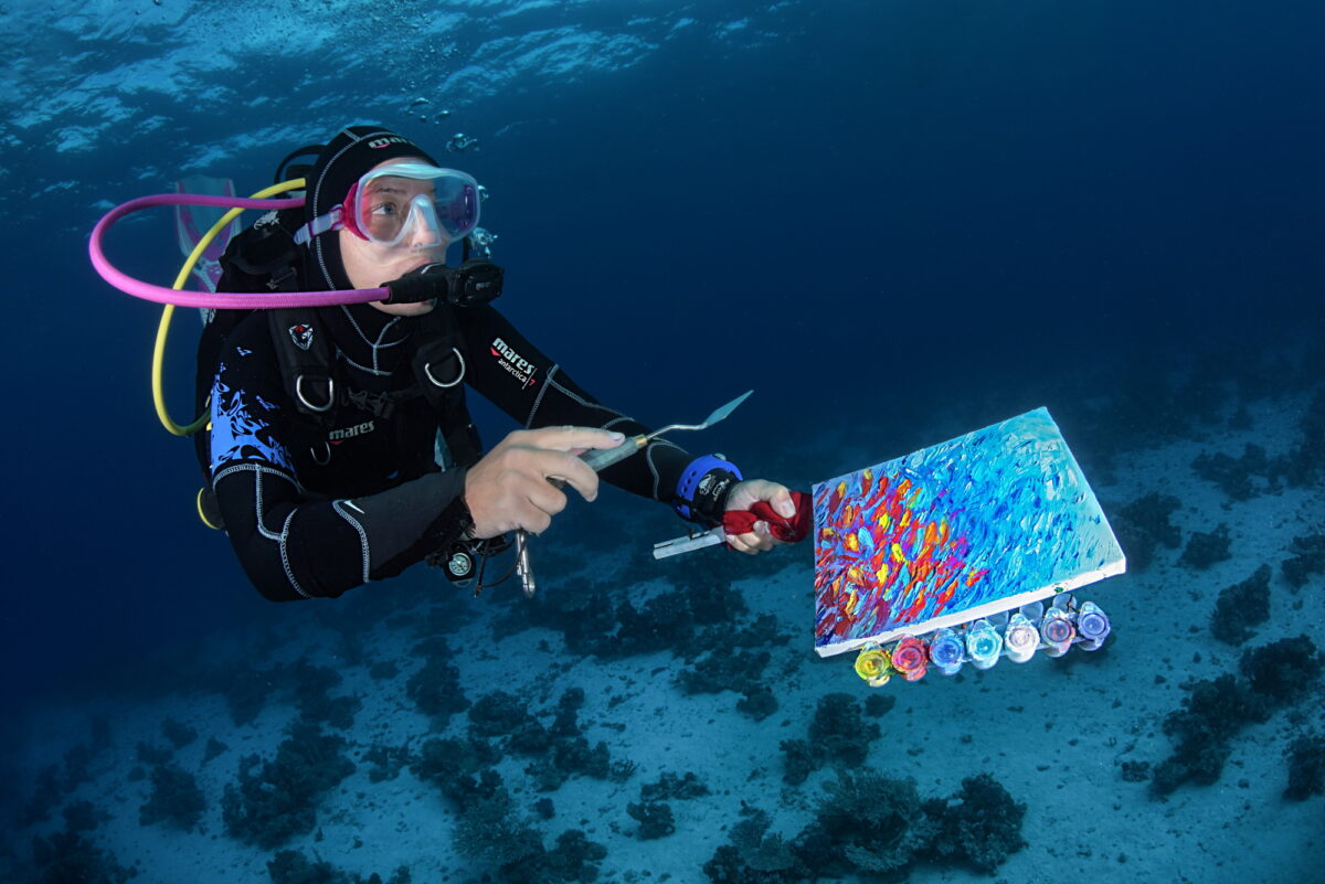 Olga creates oil painting underwater