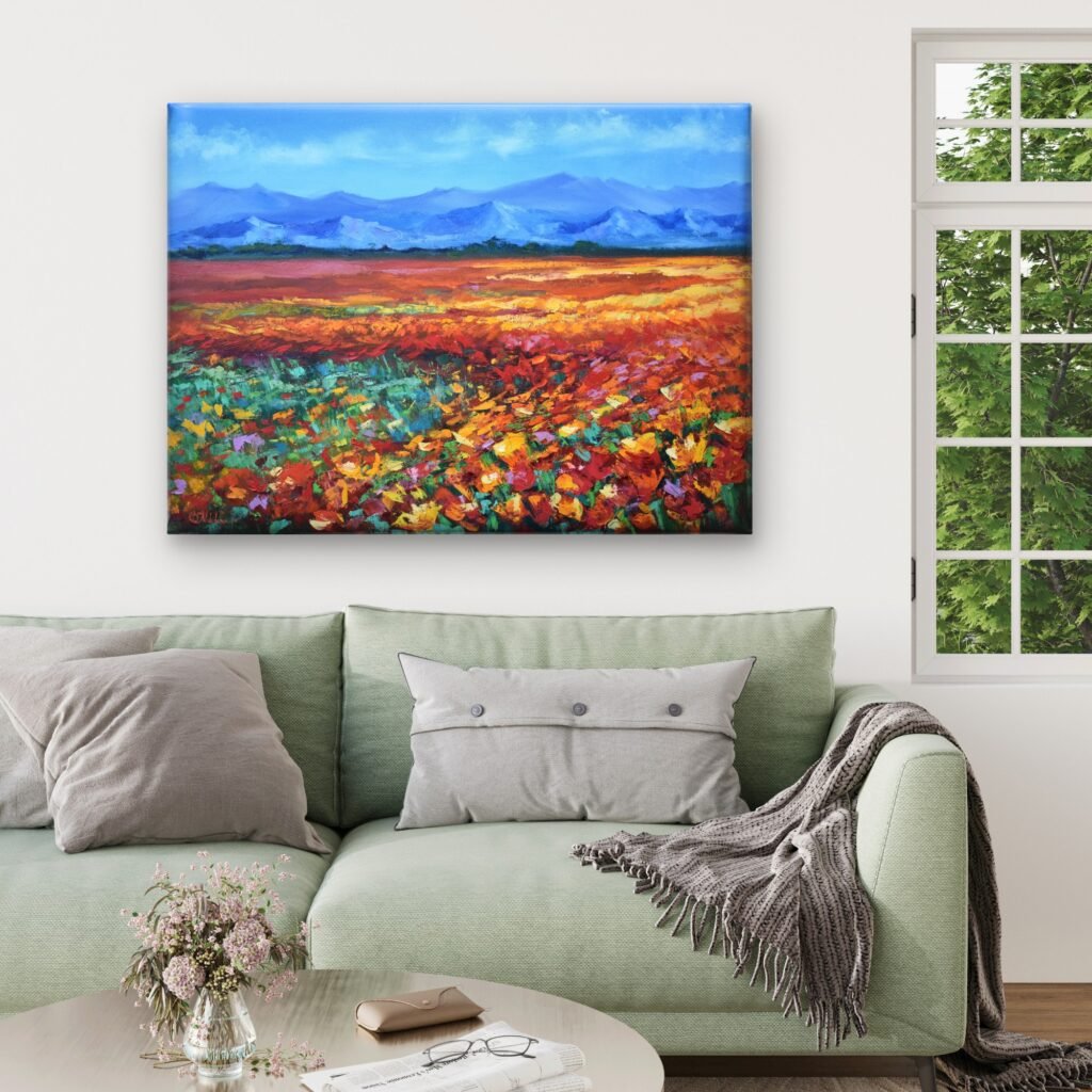 Colourful meadow oil painting with orange and yellow wildflowers, green grasses and distant blue mountains by Olga Nikitina.